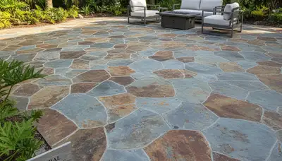Flagstone patio with natural stone pavers expertly installed by landscapers in Cape Coral, FL
